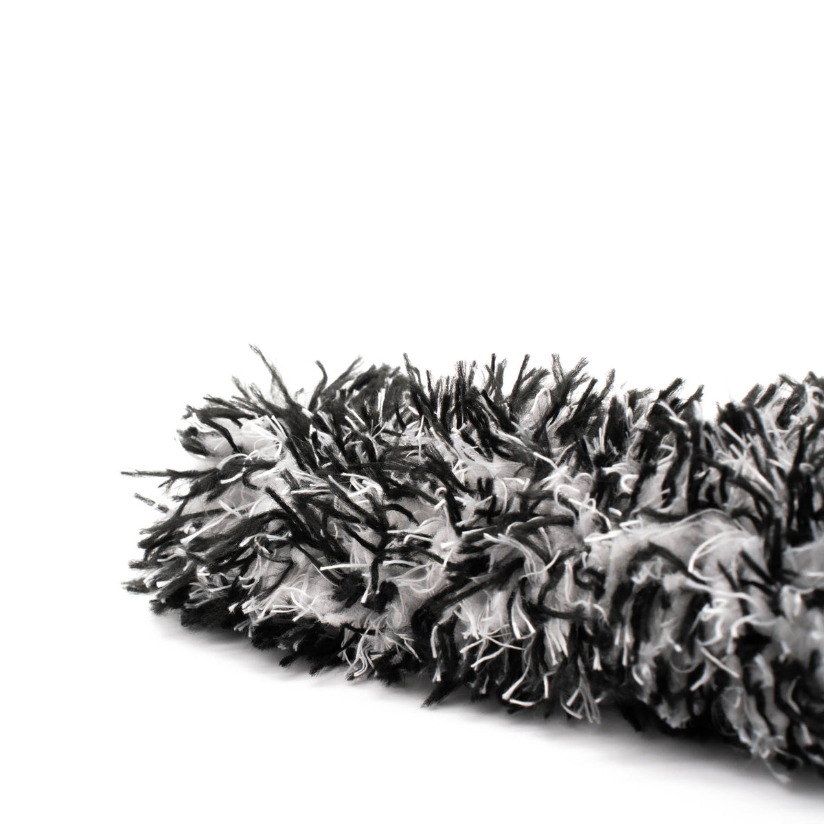 Dettaglio primo piano della cover in microfibra per spazzola Flex Brush, tessuto ultra-soft per una pulizia efficace e sicura dei cerchi auto.