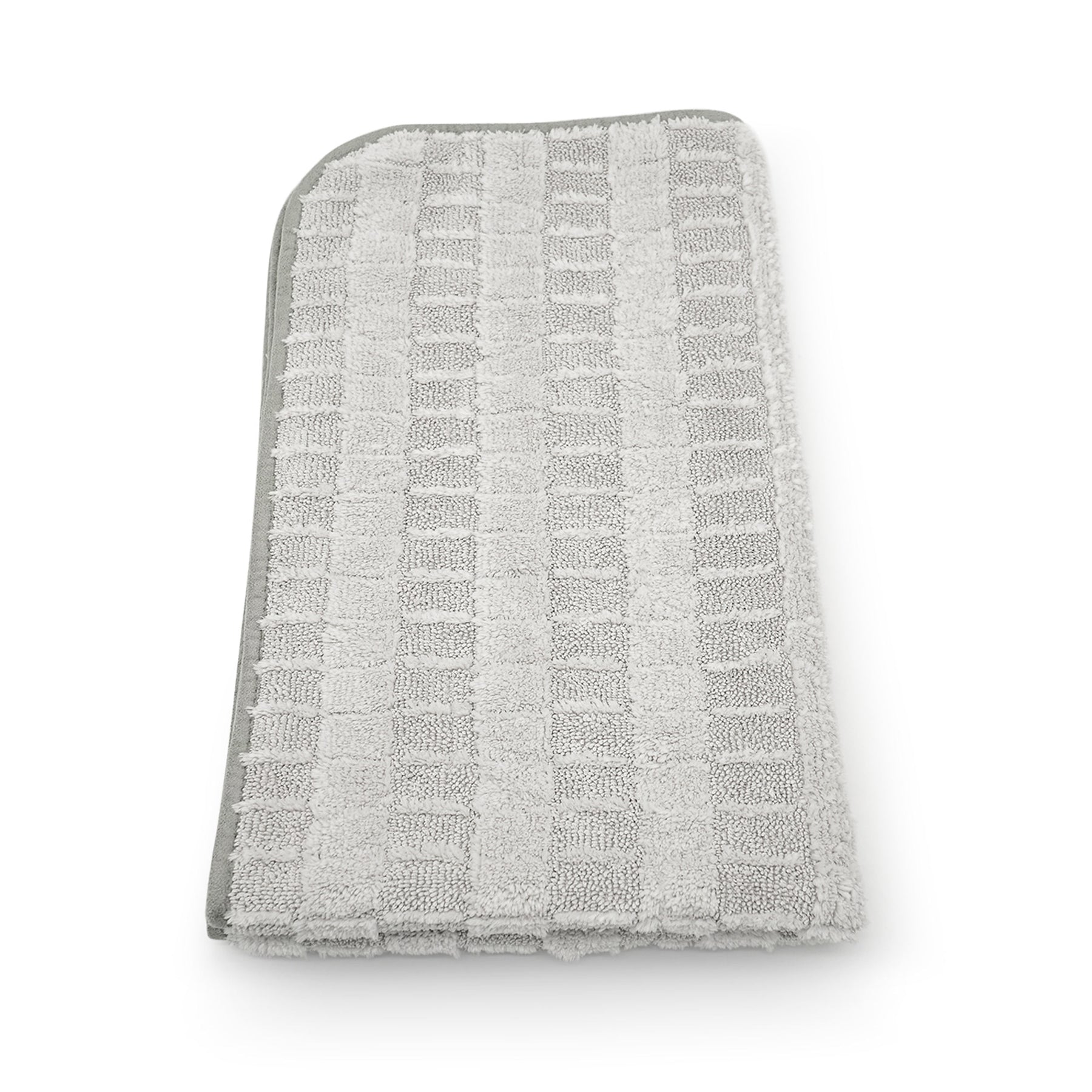 Panno asciugatura Stripped 2.0 in microfibra grigia, visto dall'alto, con texture a righe.