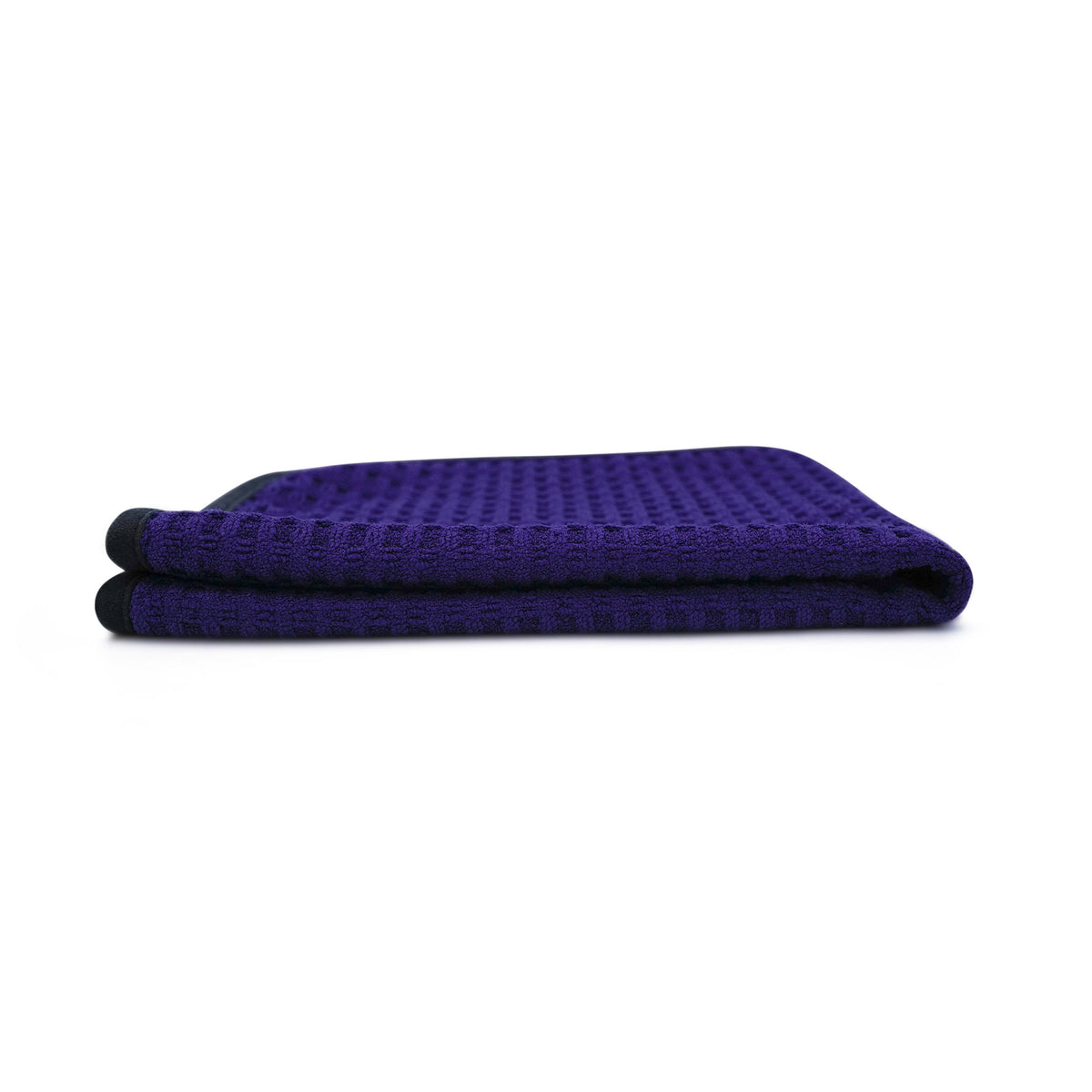 Panno microfibra Waffle 450 blu, piegato lateralmente, con trama a nido d'ape.