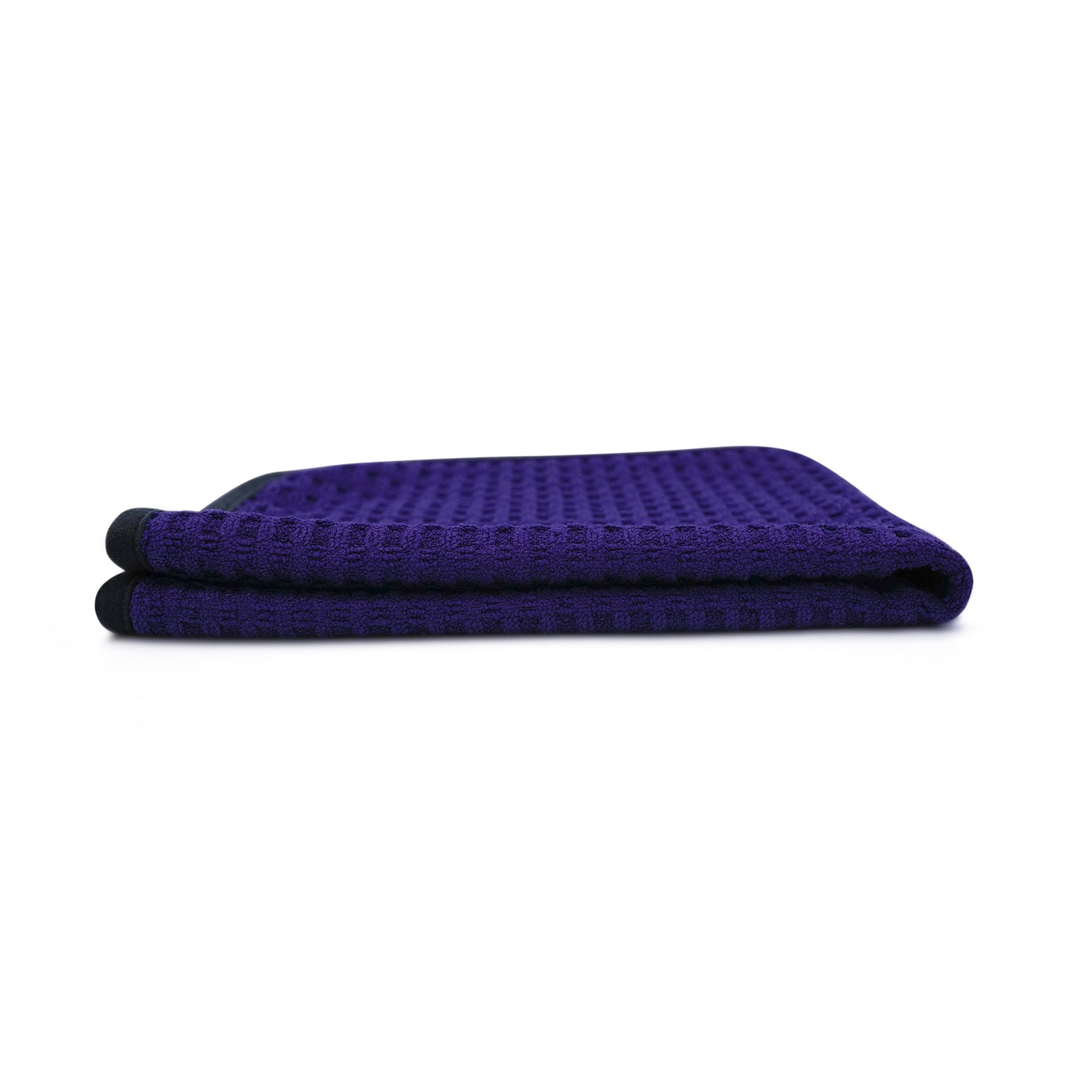 Panno microfibra Waffle 450 blu, piegato lateralmente, con trama a nido d'ape.