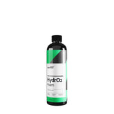 flacone di CARPRO HydrO2 Foam, un detergente e sigillante idrofobico per la protezione della carrozzeria dell'auto. Il flacone è nero con un'etichetta bianca e verde, e il nome del prodotto "HydrO2 Foam" è chiaramente visibile. Questo prodotto offre una protezione avanzata con applicazione rapida, garantendo una finitura brillante e duratura.