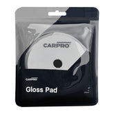 confezione CARPRO Gloss Pad, contenente un pad circolare bianco da 130 mm per lucidatura auto, con un foro centrale e logo CARPRO.