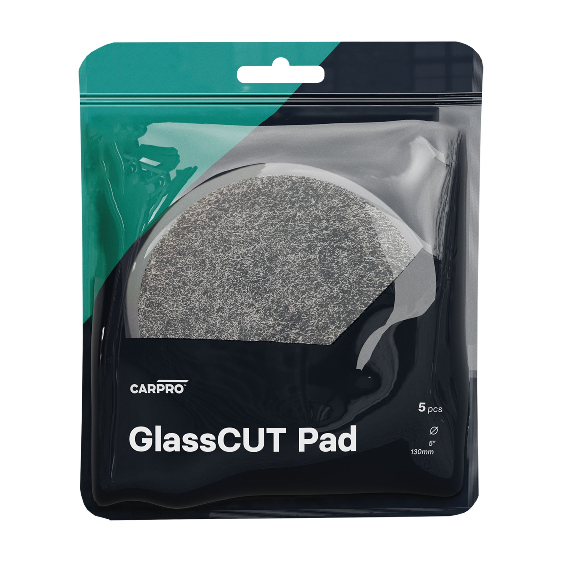 una confezione di CARPRO GlassCUT Pad, contenente 5 pad circolari da 130 mm di diametro. I pad sono di colore grigio e sono progettati per la lucidatura del vetro. La confezione ha una sezione trasparente che permette di vedere i pad all'interno.