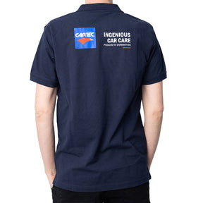Retro polo CARTEC blu navy con scritta “Ingenious Car Care”, design tecnico
