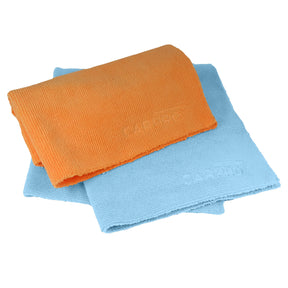 Panni in microfibra CARPRO 2Face in arancione e azzurro, ideali per una pulizia profonda e delicata del veicolo, perfetti per detailers professionisti.
