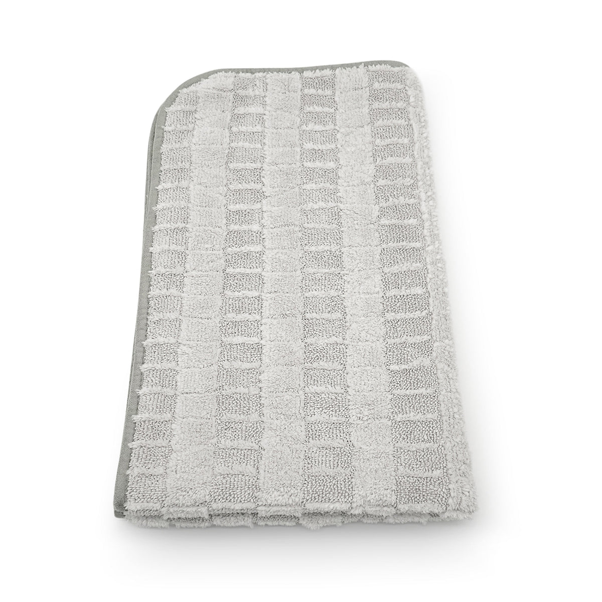 Panno asciugatura Stripped 2.0 in microfibra grigia, visto dall'alto, con texture a righe.